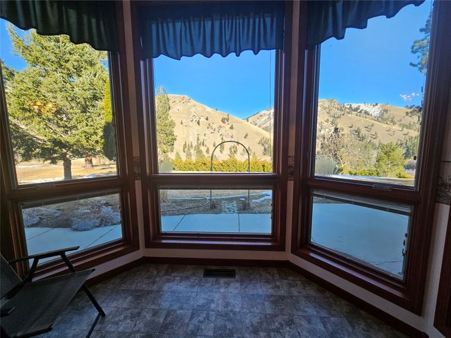 Please note the stain glass window over the door and the excellent view of the Sapphires out of the oversized windows in the living area | Image 12