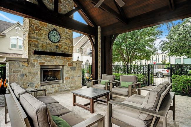 The Villas at Spring Branch has a spacious outdoor entertaining area next to the pool. This is a great spot to hang out with your neighbors, host a birthday party, or casual meeting. | Image 36