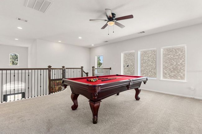 Recreation room with a ceiling fan, carpet floors, billiards table, and recessed lighting | Image 23