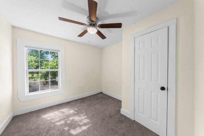 Unfurnished bedroom 3 with carpet, baseboards, and a ceiling fan | Image 20