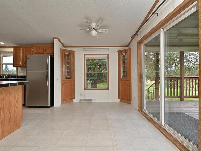 Dining room with built-ins and walk out to the covered porch | Image 9