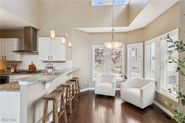 Kitchen layout with counter seating and cozy sitting space | Image 10