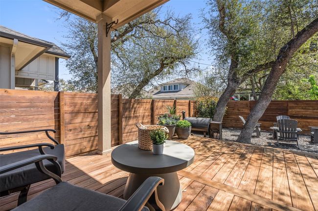 Wooden deck featuring a fenced backyard | Image 35