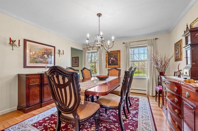 Spacious dining room with hardwood floors. | Image 13