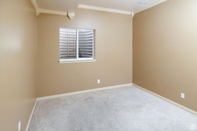 Bedroom #6 featuring ornamental molding and carpet flooring | Image 27