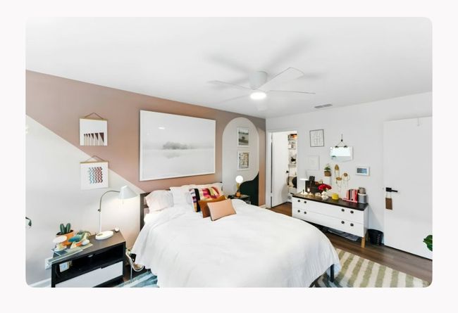 Bedroom with wood finished floors and a ceiling fan | Image 10