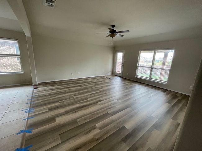 Unfurnished room featuring a ceiling fan and wood finished floors | Image 16