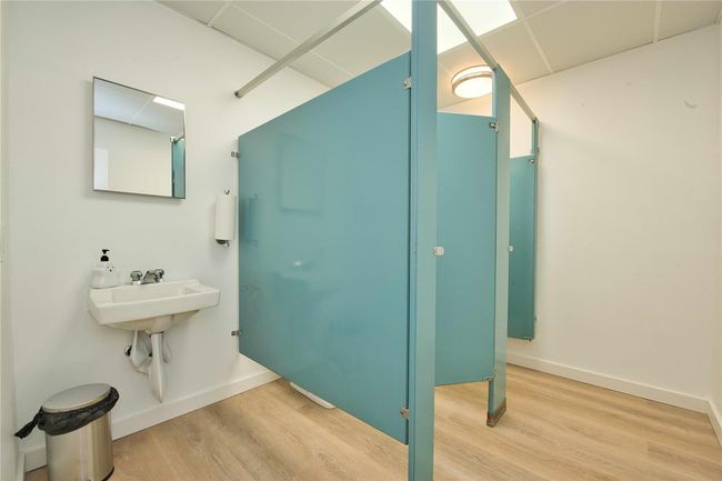 Bathroom with wood finished floors and baseboards | Image 8