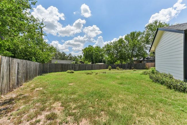 View of fenced backyard | Image 35