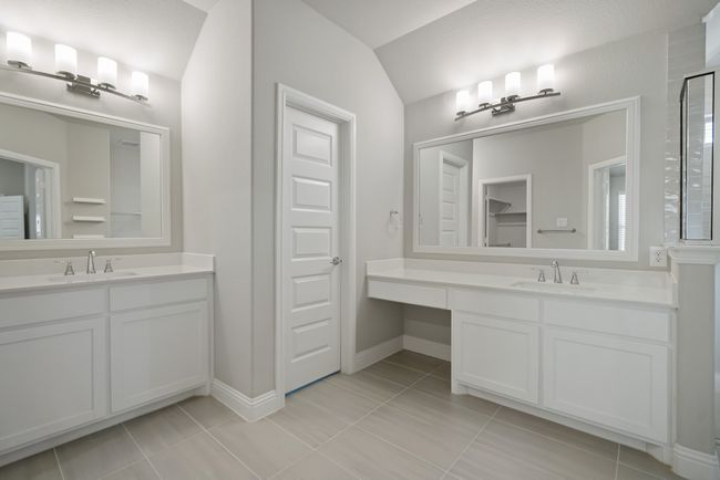 Full bathroom with tile patterned flooring, a sink, and two vanities | Image 20