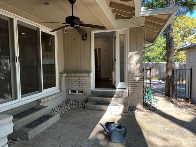 View of exterior entry featuring brick siding | Image 25