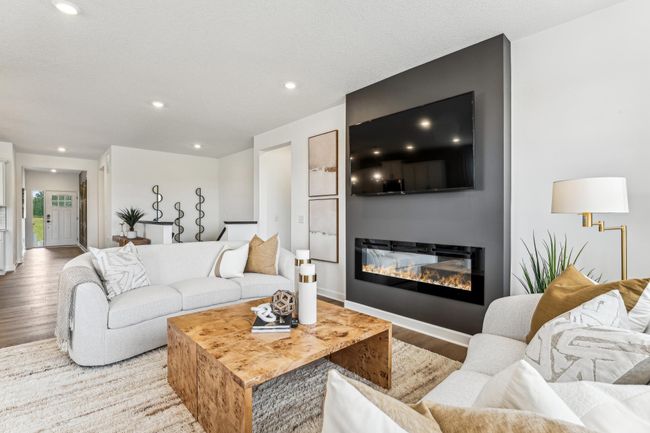 Photo is of the actual model. Cozy up next to the fireplace. | Image 4