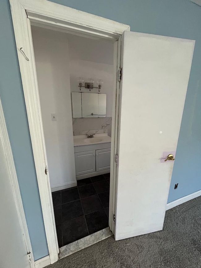 Bathroom featuring tasteful backsplash and vanity | Image 17