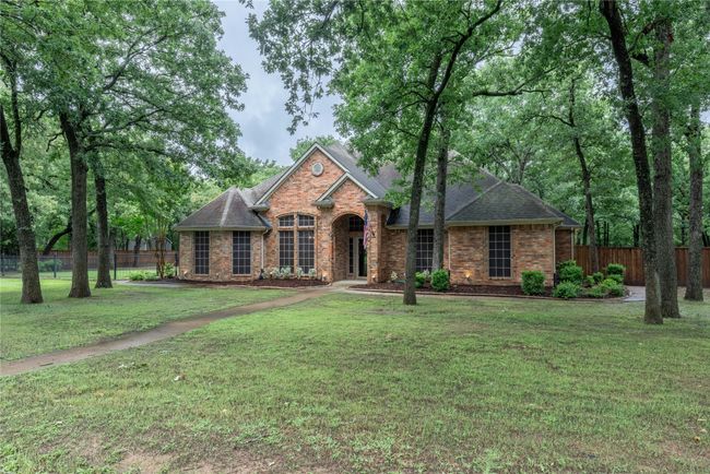 View of front of property featuring brick siding and roof with shingles | Image 4