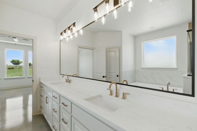 Full bathroom with double vanity and a bathtub | Image 14