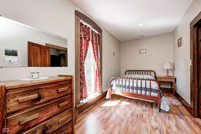 bedroom with visible vents, baseboards, light wood finished floors, and recessed lighting | Image 45