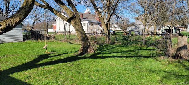 partial fenced back yard | Image 12