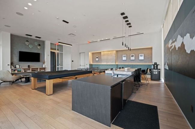 Recreation room featuring a sink and light wood-type flooring | Image 39