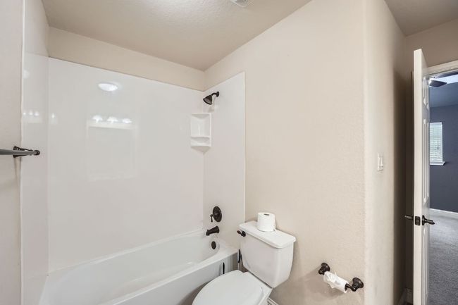 Full bathroom with shower / tub combination and toilet | Image 26