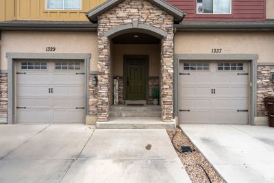 Entrance to property featuring a garage | Image 2