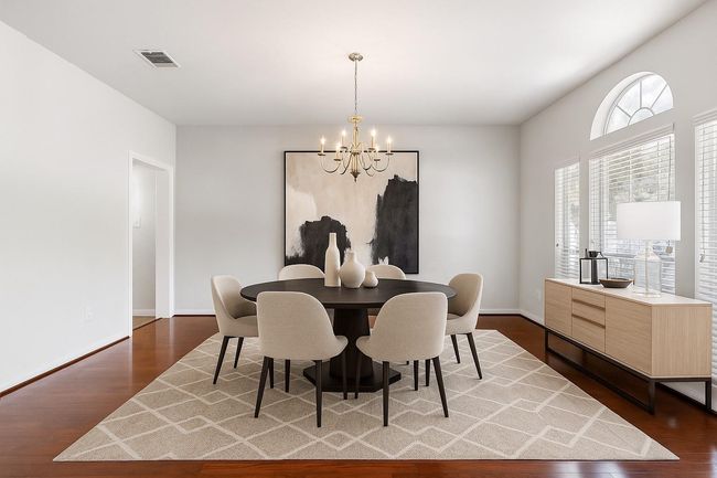 Formal dining room to the right upon entry into home. Virtually staged to show space and design versatility. | Image 5