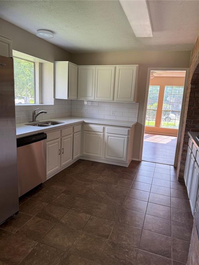 view of the kitchen from breakfast area | Image 19