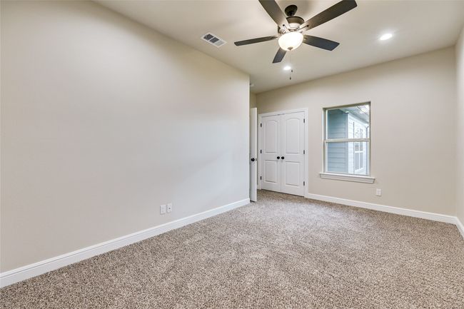 Carpeted bedroom featuring baseboards, ceiling fan, and recessed lighting | Image 13