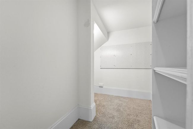 There’s a secret walk-in closet hidden behind the office door—perfect for storing supplies, files, or anything you need out of sight. | Image 12