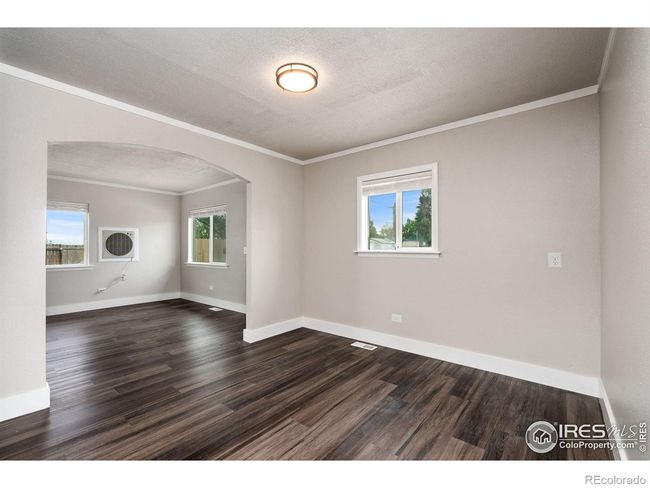 Dining room looking into the living room. | Image 7