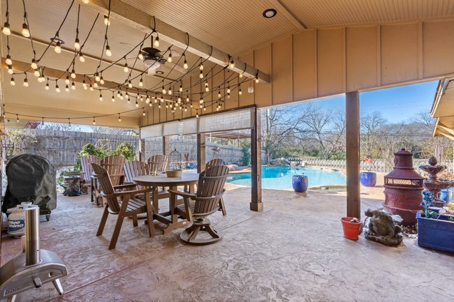 View of Large Covered BACK patio / terrace with a fenced in pool, area for grilling, and ceiling fan | Image 30