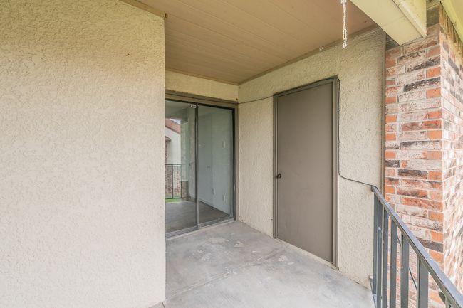 Entrance to property with stucco siding and brick siding | Image 27
