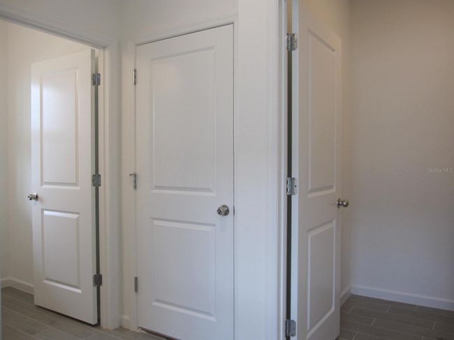 Half bathroom, garage, laundry area | Image 12