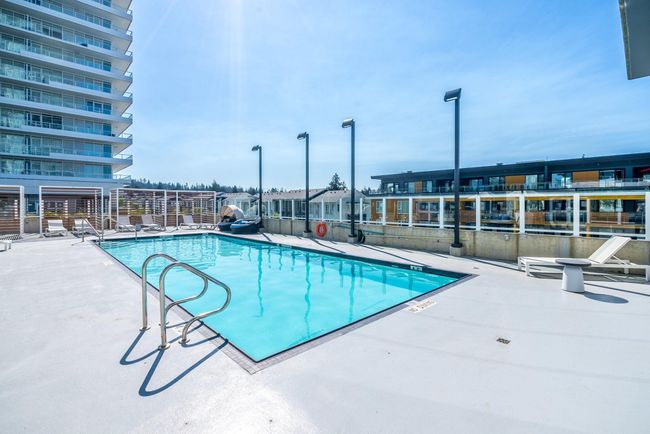 Community pool with a patio area | Image 18