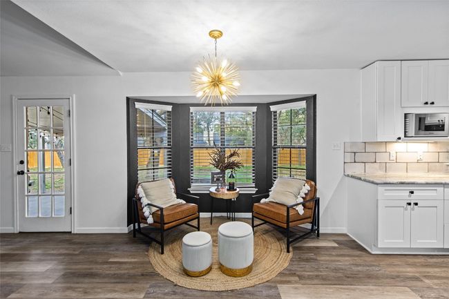 Take in yard views through the bay window in the breakfast area. | Image 5