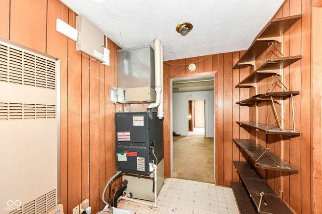 Hallway from living room to bedroom 3, additional storage shelves and brand new furnace! | Image 14