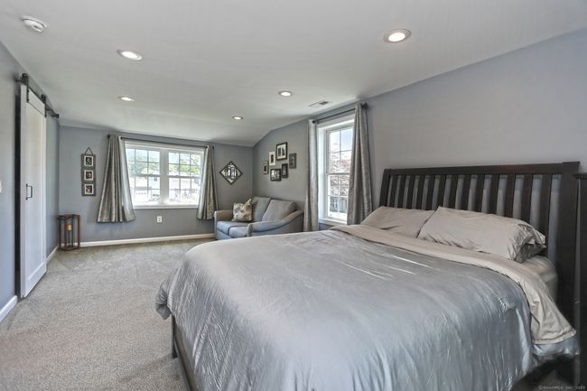 Oversized Primary bedroom with cozy sitting area. | Image 22