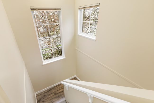 Staircase featuring wood finished floors, baseboards, and plenty of natural light | Image 28