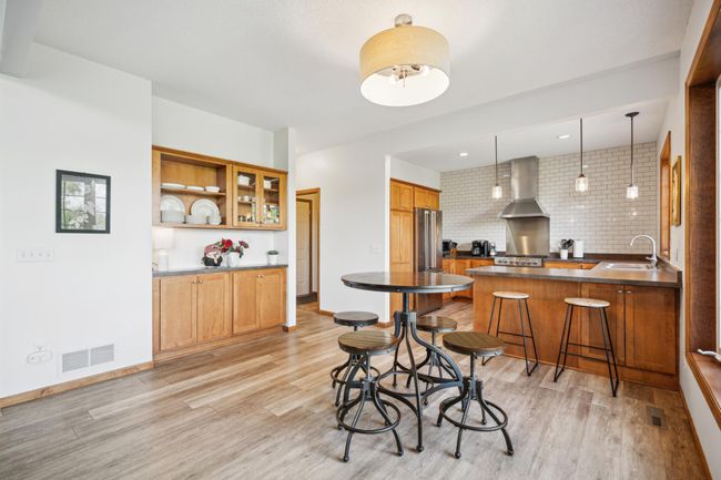 The main level features soaring vaulted ceilings and an abundance of windows that flood the space with natural light | Image 15