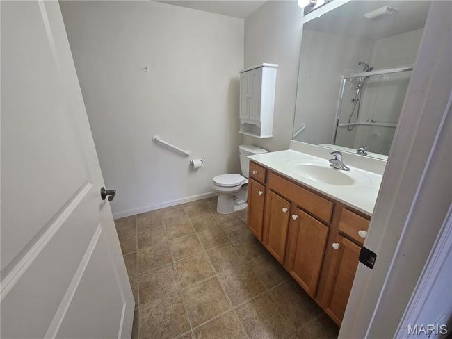 Bathroom with a stall shower, vanity with storage, linen closet | Image 18