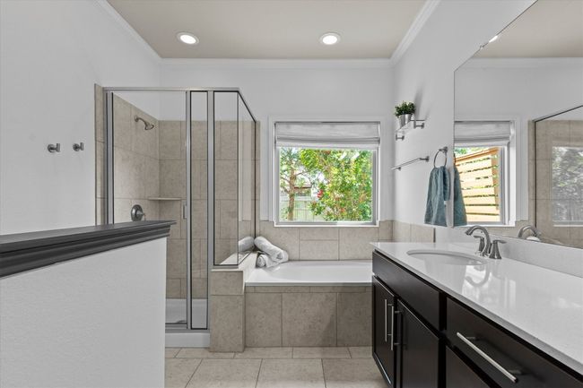 Full bathroom with vanity, a bath, a stall shower, tile patterned flooring, and ornamental molding | Image 27
