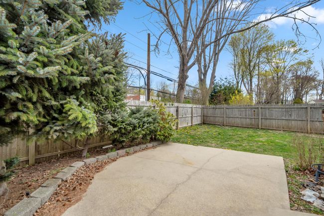 View of patio / terrace with a fenced backyard | Image 13