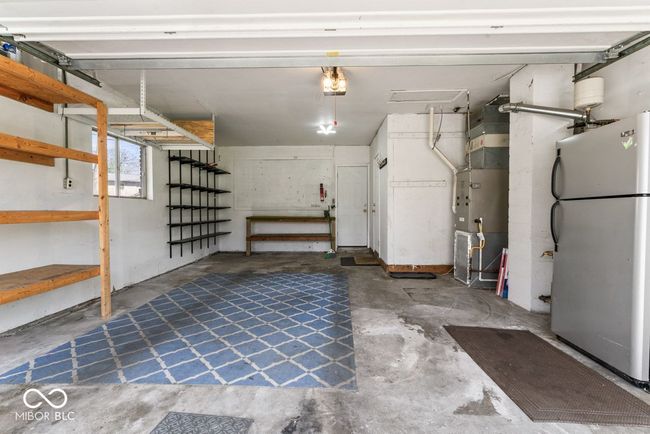 garage with freestanding refrigerator | Image 28