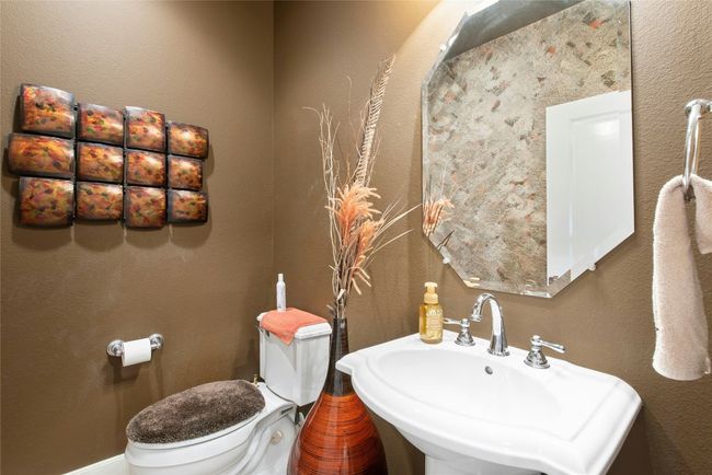 Half bathroom with toilet and a sink | Image 10
