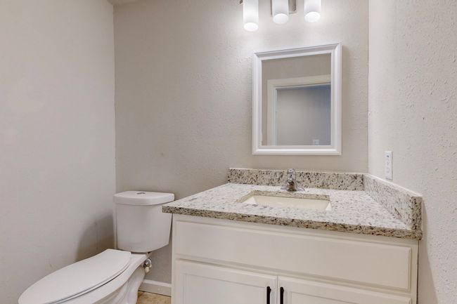Bathroom featuring vanity and toilet | Image 35