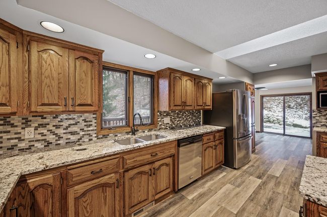 Clean & gorgeous solid wood cabinetry - Don't miss the extra bonus sunroom just off the sliding glass doors - | Image 19