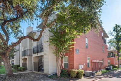 View of property exterior featuring central AC unit and a balcony | Image 1