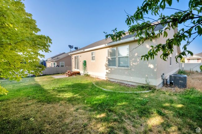 Rear view of property featuring stucco siding | Image 19