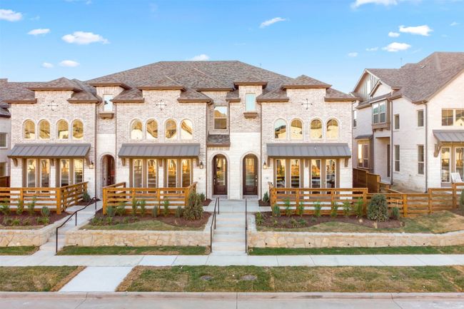 View of front of house featuring brick siding and roof with shingles | Image 5