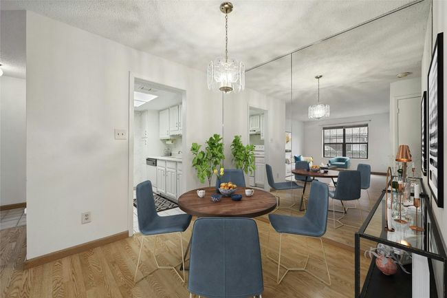 Dining area, which connects to the kitchen and is open to the living space. | Image 5