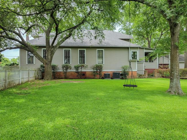 Discover tranquility on this expansive property, perfect for play, pets, or a pool. Enjoy endless possibilities with ample space for sports or a new homestead. | Image 4